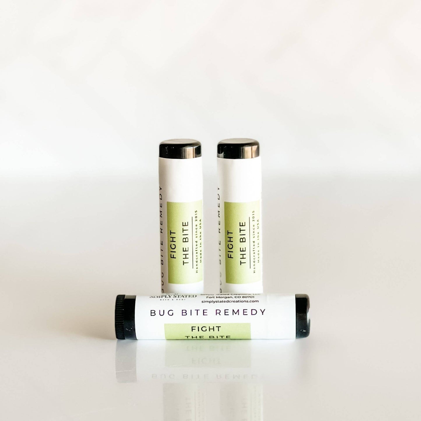 Three bottles of 'Fight the Bite' bug bite remedy on a white background