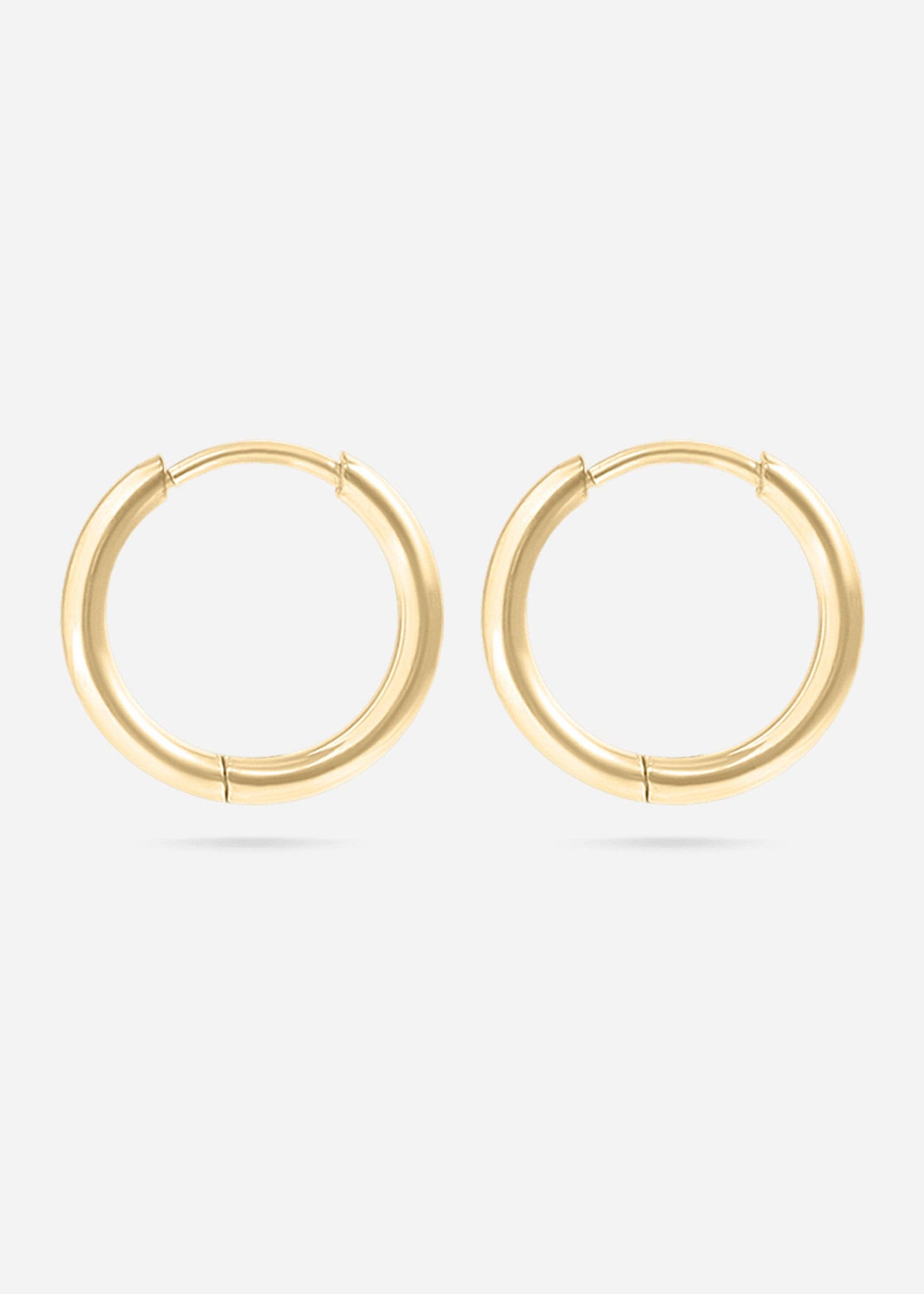 Gold hoop earrings on a white background
