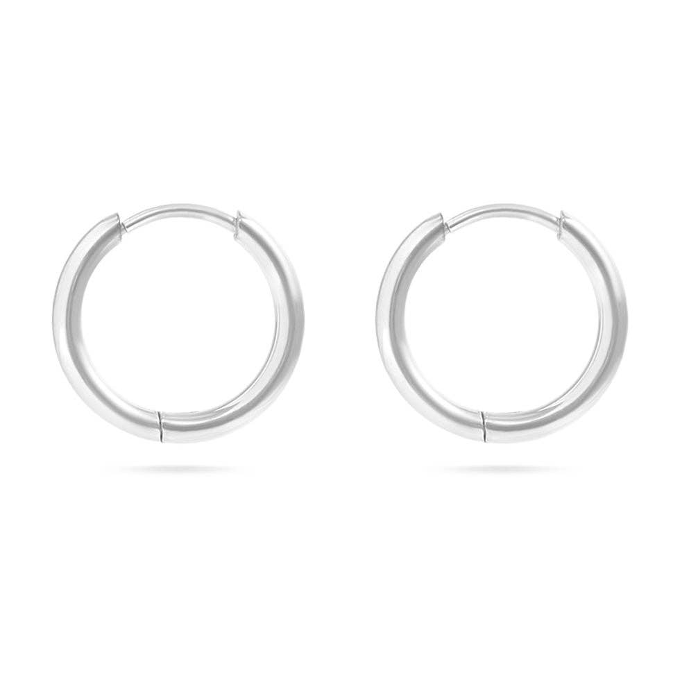 Pair of silver hoop earrings on a white background