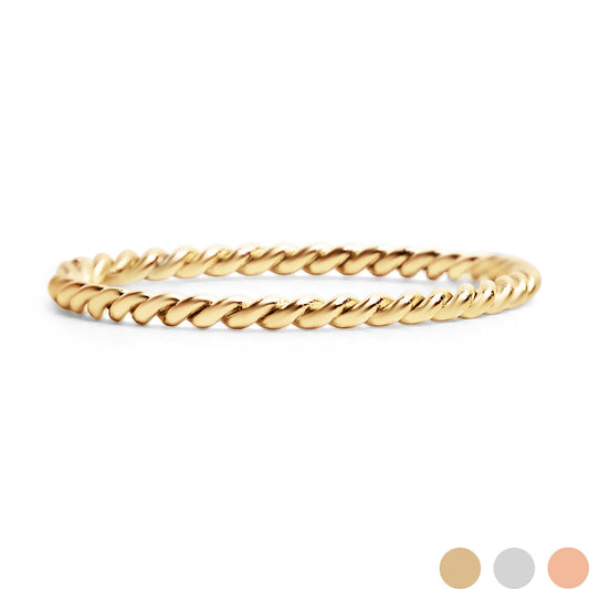 Gold braided ring on a white background