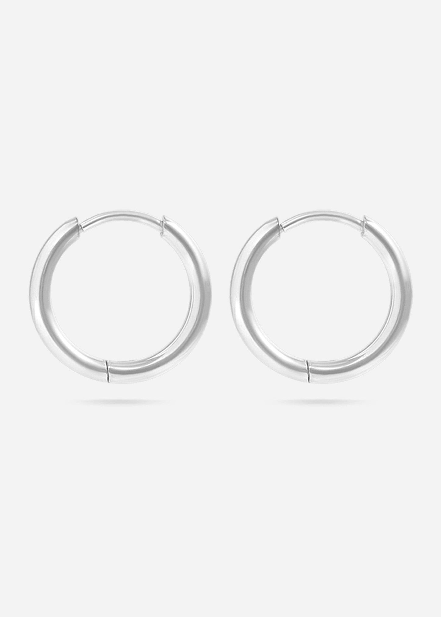 Pair of silver hoop earrings on a white background